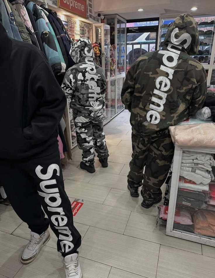 Supreme camo tracksuits inside a streetwear store